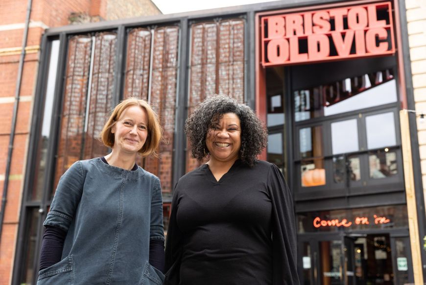 two women (Charlotte Geeves and Nancy Medina) standing outside of the Bristol Old Vic